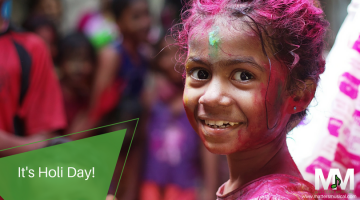 Indian girl covered in paint for Holi